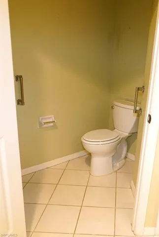 Bathroom featuring tile patterned floors and baseboards