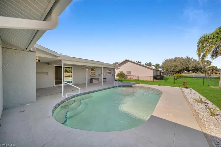 View of pool featuring a yard and a patio