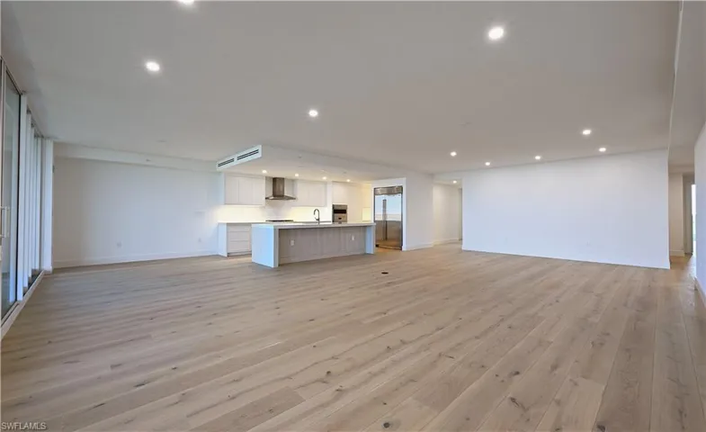 Unfurnished living room featuring light wood-type flooring