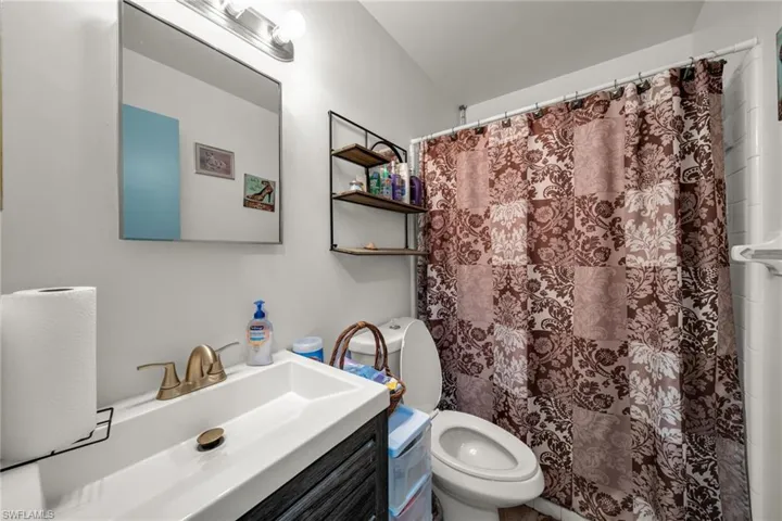 Bathroom featuring vanity and a shower with curtain