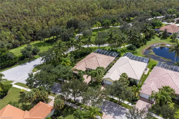 Aerial perspective of suburban area with a large body of water