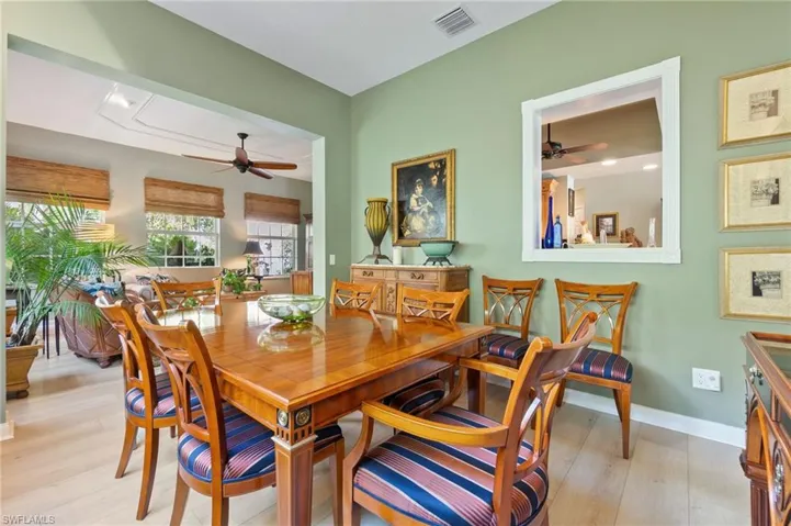 Dining space featuring ceiling fan and light wood-style floors