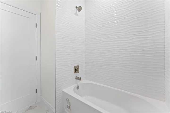 Bathroom featuring tiled shower / bath