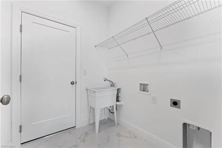 Laundry area with washer hookup and electric dryer hookup