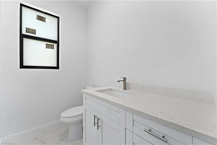 Bathroom with vanity and toilet