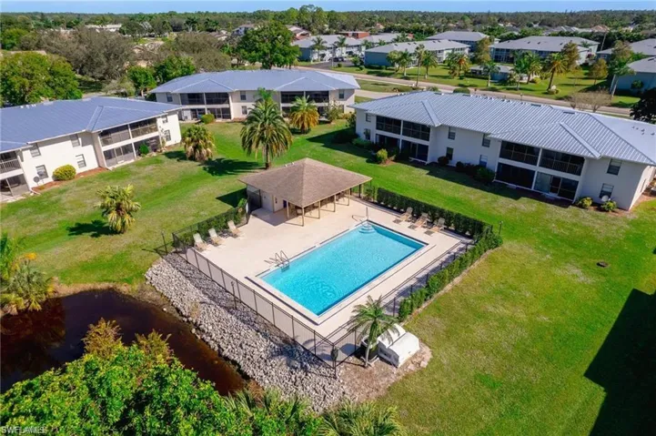 View of swimming pool featuring a yard and a patio area