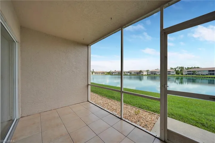 Unfurnished sunroom with a water view