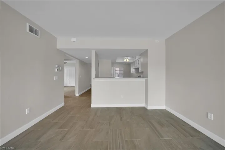 Unfurnished living room featuring hardwood / wood-style floors