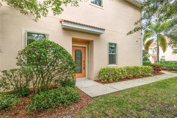 Doorway to property with stucco siding