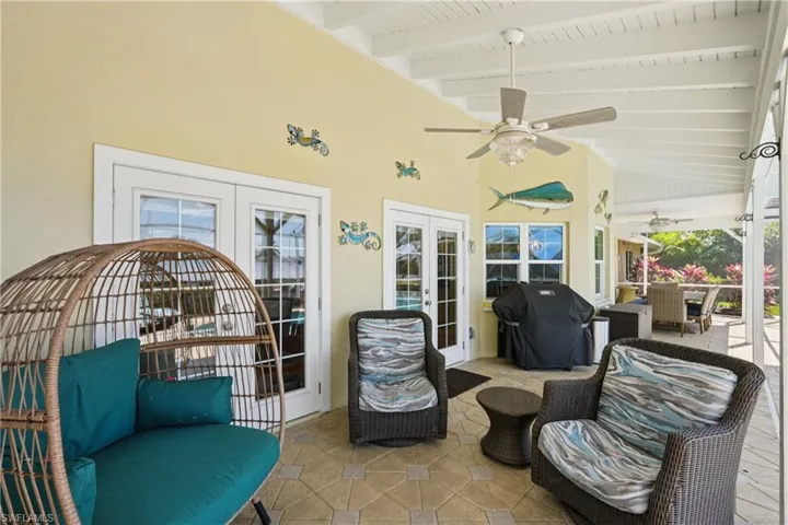 View of patio with french doors, a grill, an outdoor lounge area, and ceiling fan