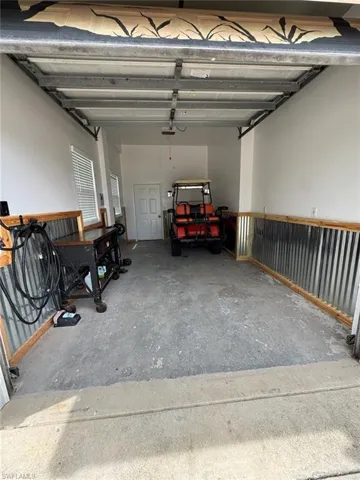 Garage featuring windows and a garage door opener