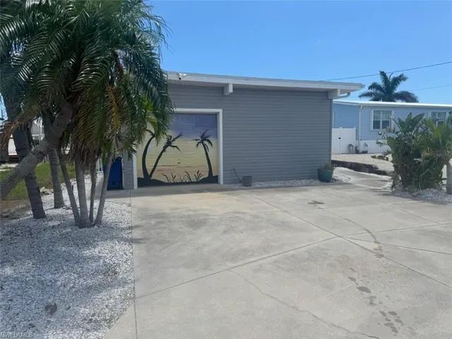 View of home's exterior featuring driveway and an attached garage