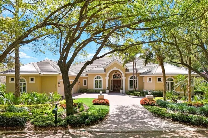 3-Car Side-Entry Garage so Striking Mahogany Entry Doors Take Center Stage