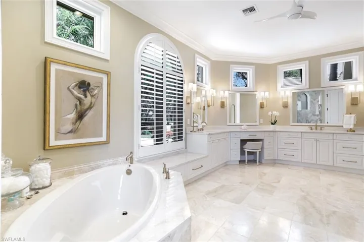 Quartzite-topped Custom Wood Cabinetry & Exquisite Designer Fixtures