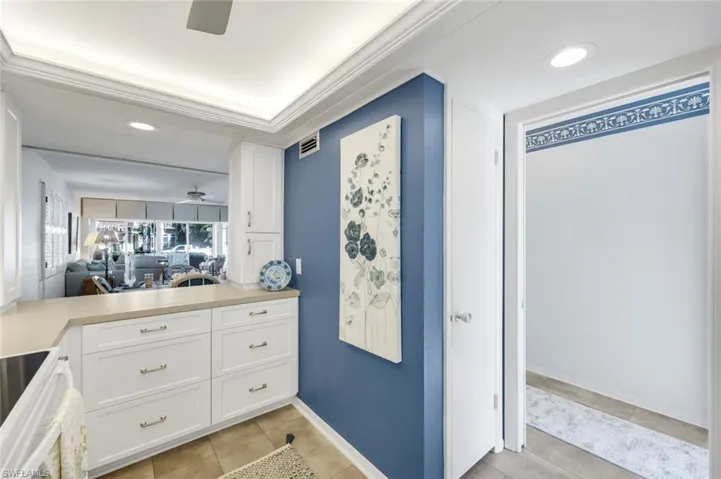 Pass through to dining room, door to foyer and small pantry w/door.