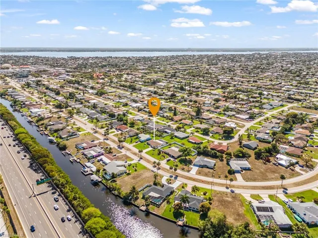 Aerial view of residential area with a nearby body of water
