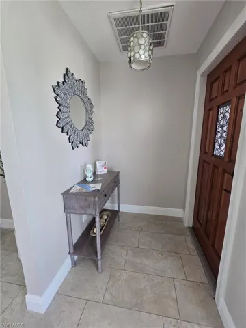 Foyer with custom door & lighting