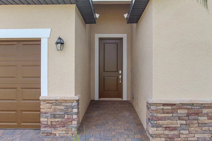Stucco exterior with stacked stone accents