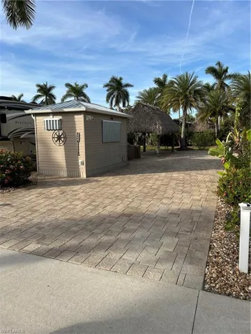 View of gate featuring a patio area