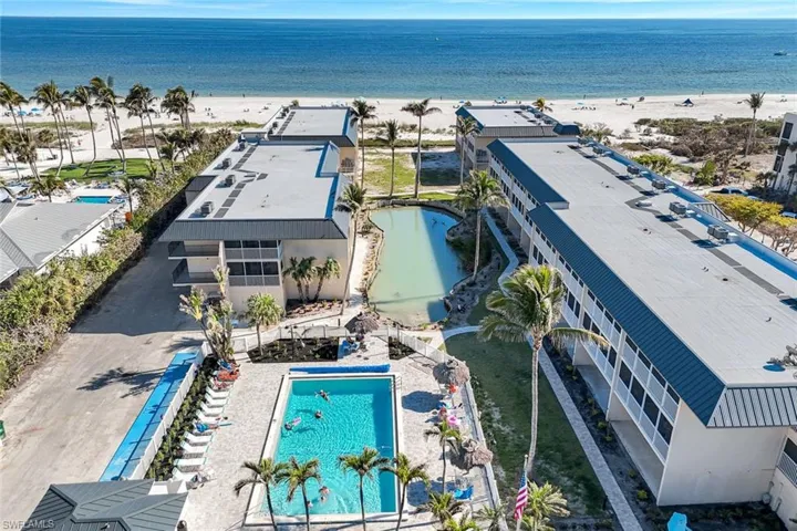 Bird's eye view featuring a water view and a view of the beach