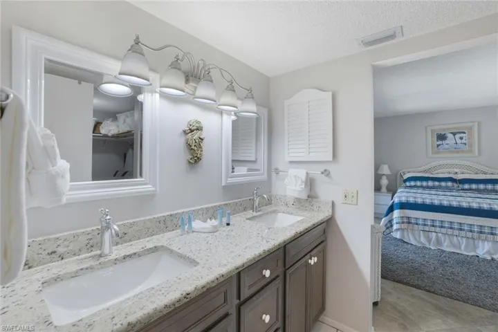 Bathroom with vanity and a textured ceiling
