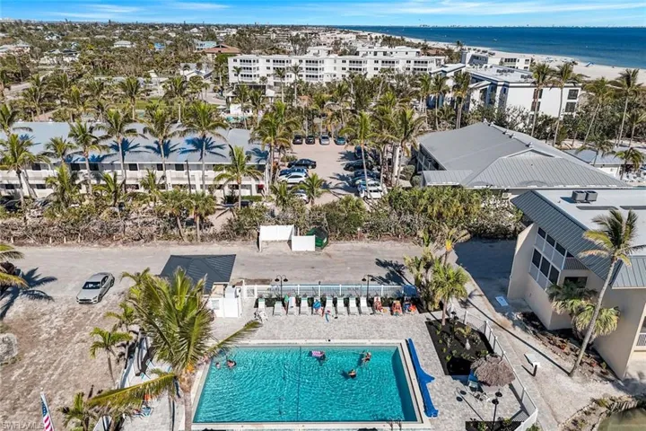 Birds eye view of property with a water view
