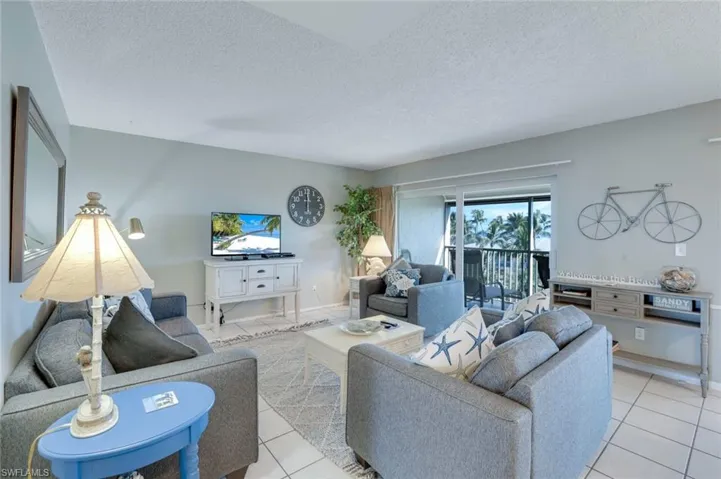 Tiled living room with a textured ceiling