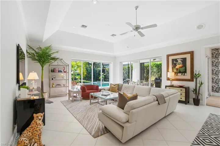 High Tray ceiling makes this large great room inviting for all.
