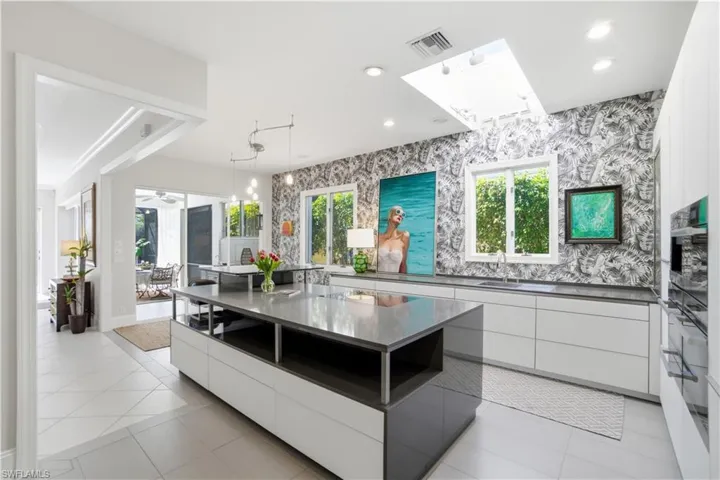 Open and Airy Kitchen with Miele Refrigerator, Miele Coffeemaker, Miele Steamer, Miele Microwave. Miele Oven and Miele Warming Drawer.  Beautiful Streamline look.