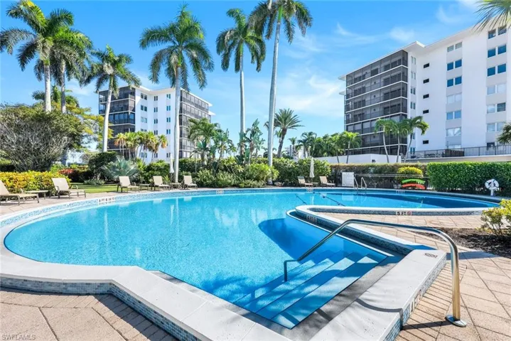 Community pool featuring a patio