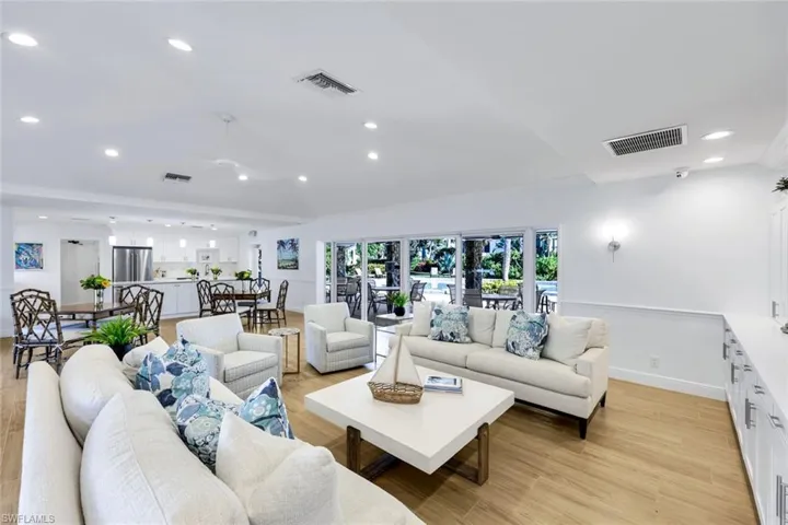 Living area featuring recessed lighting and light wood-style flooring