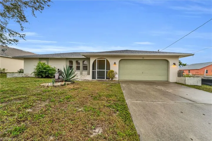 Ranch-style house featuring stucco siding, concrete driveway, a front lawn, and an attached garage