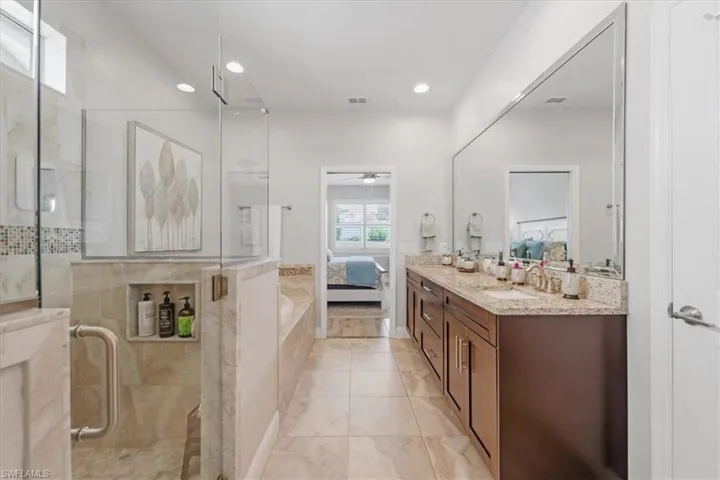 Bathroom featuring tile flooring and oversized vanity