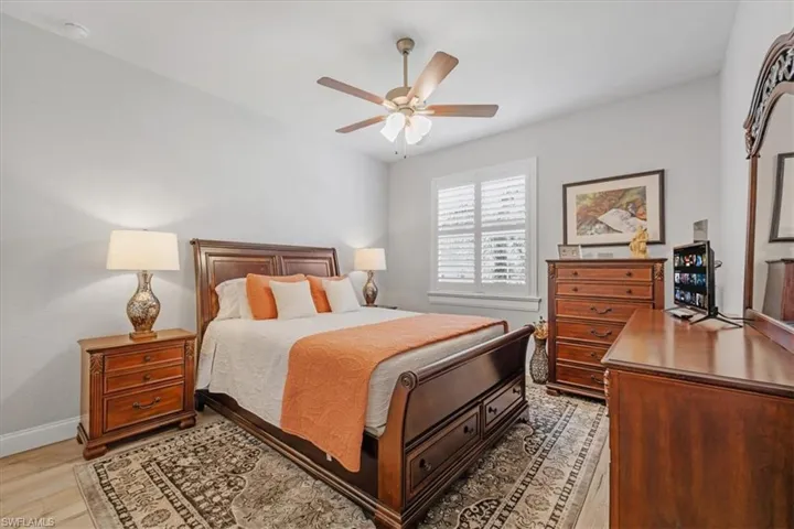 Bedroom with light wood-type flooring and ceiling fan