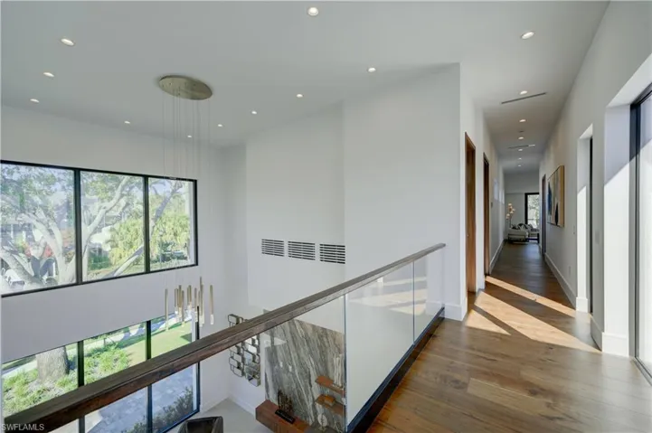 Corridor featuring dark hardwood / wood-style flooring