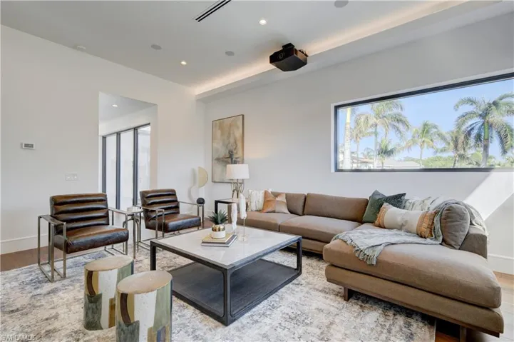 Living room with light hardwood / wood-style flooring