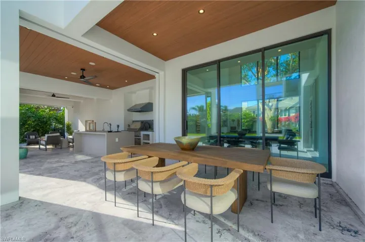 View of patio featuring ceiling fan and exterior kitchen