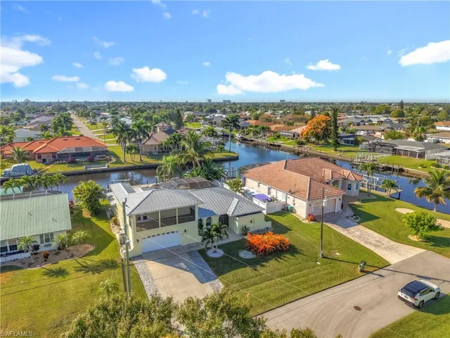 Aerial perspective of suburban area with a nearby body of water