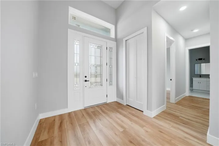 Entryway featuring light wood-style flooring and baseboards