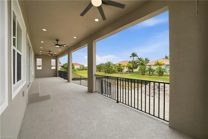 Balcony with ceiling fan and a residential view