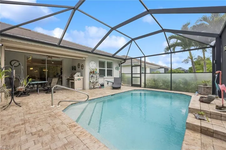 Paved pool deck with extended screened lanai