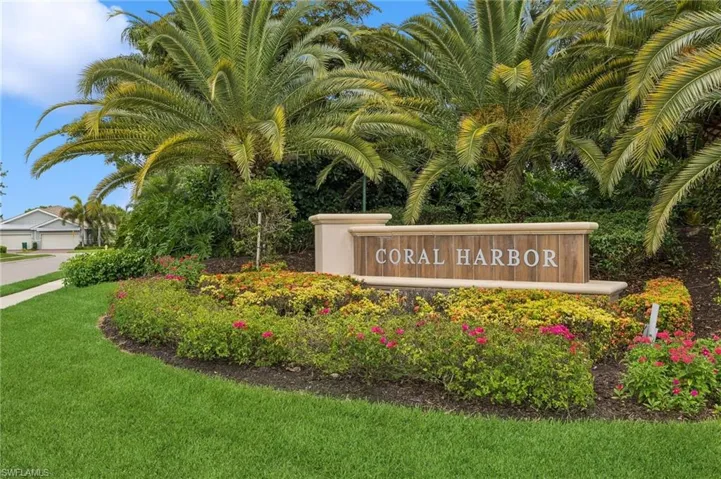 Community / neighborhood sign with a lawn