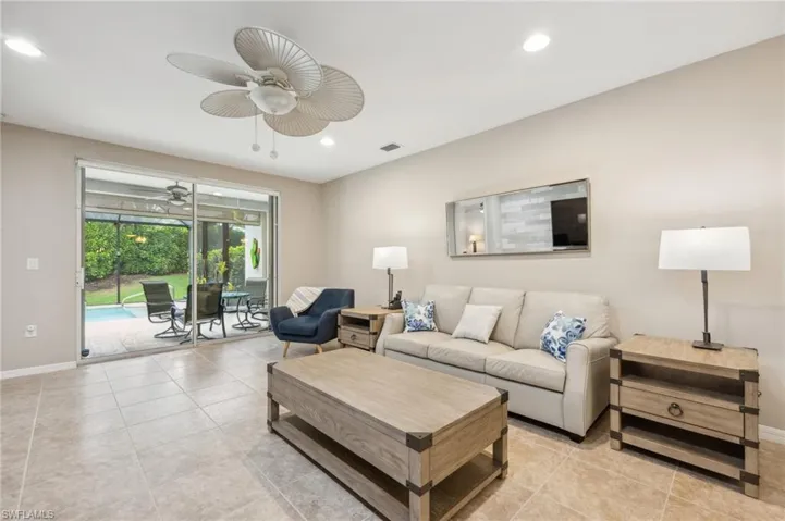 Tiled living room with ceiling fan