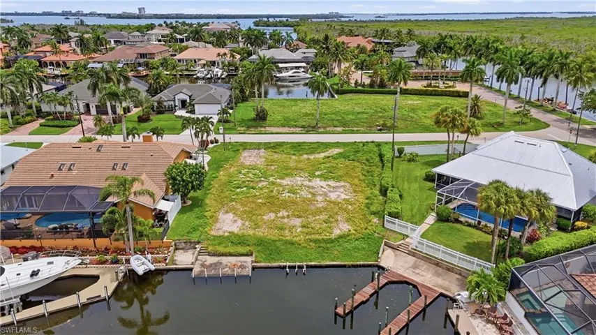 Waterfront land parcel with direct canal frontage and existing dock infrastructure