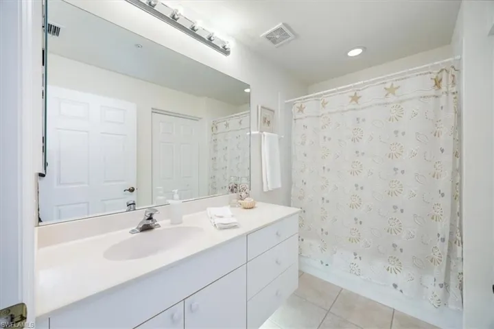 Full guest bathroom has a linen closet