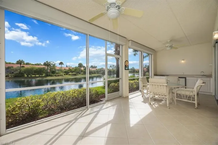 Large lanai with electric storm shutters and summer kitchen