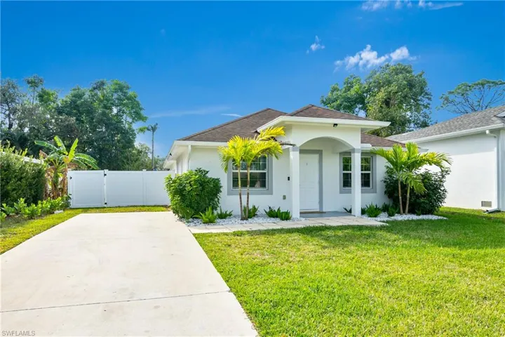 View of front of property with a front yard