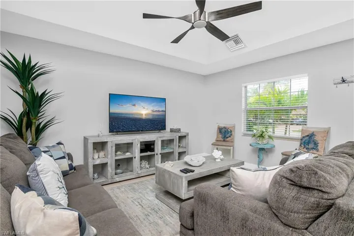 Living room featuring ceiling fan