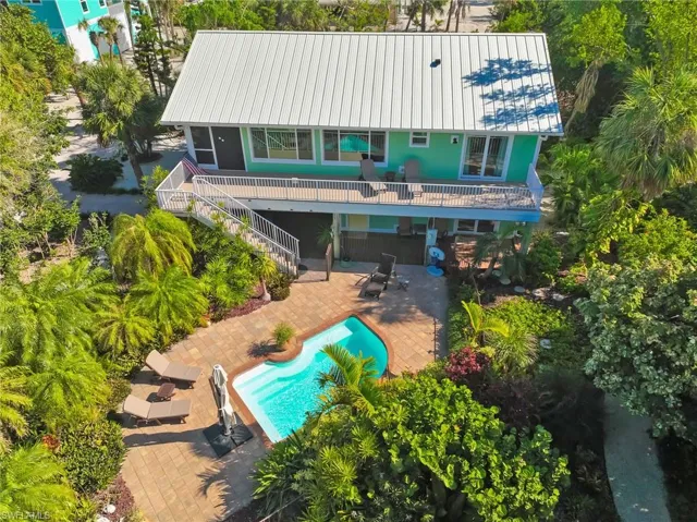 Rear view of property featuring a patio area