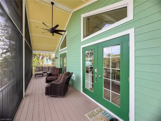 Wooden deck with french doors and ceiling fan